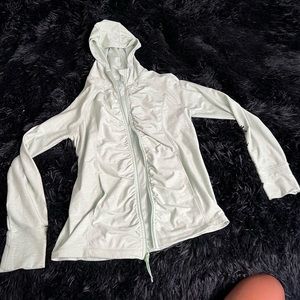Fitted zip up jacket with finger holes